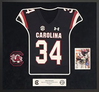 Framed Carolina jersey with number 34 display.