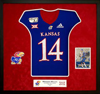 Framed Kansas jersey with number 14 display.