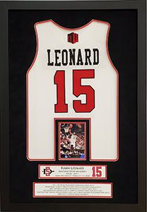 Framed basketball jersey with number 15.