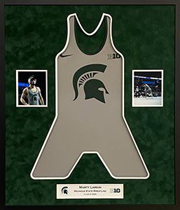 Wrestling singlet display with Spartan logos.