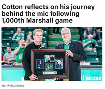 Two men holding framed memorabilia on court.